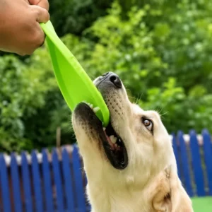 Bite resistant dog flying disc flexing while a dog bites and pulls it