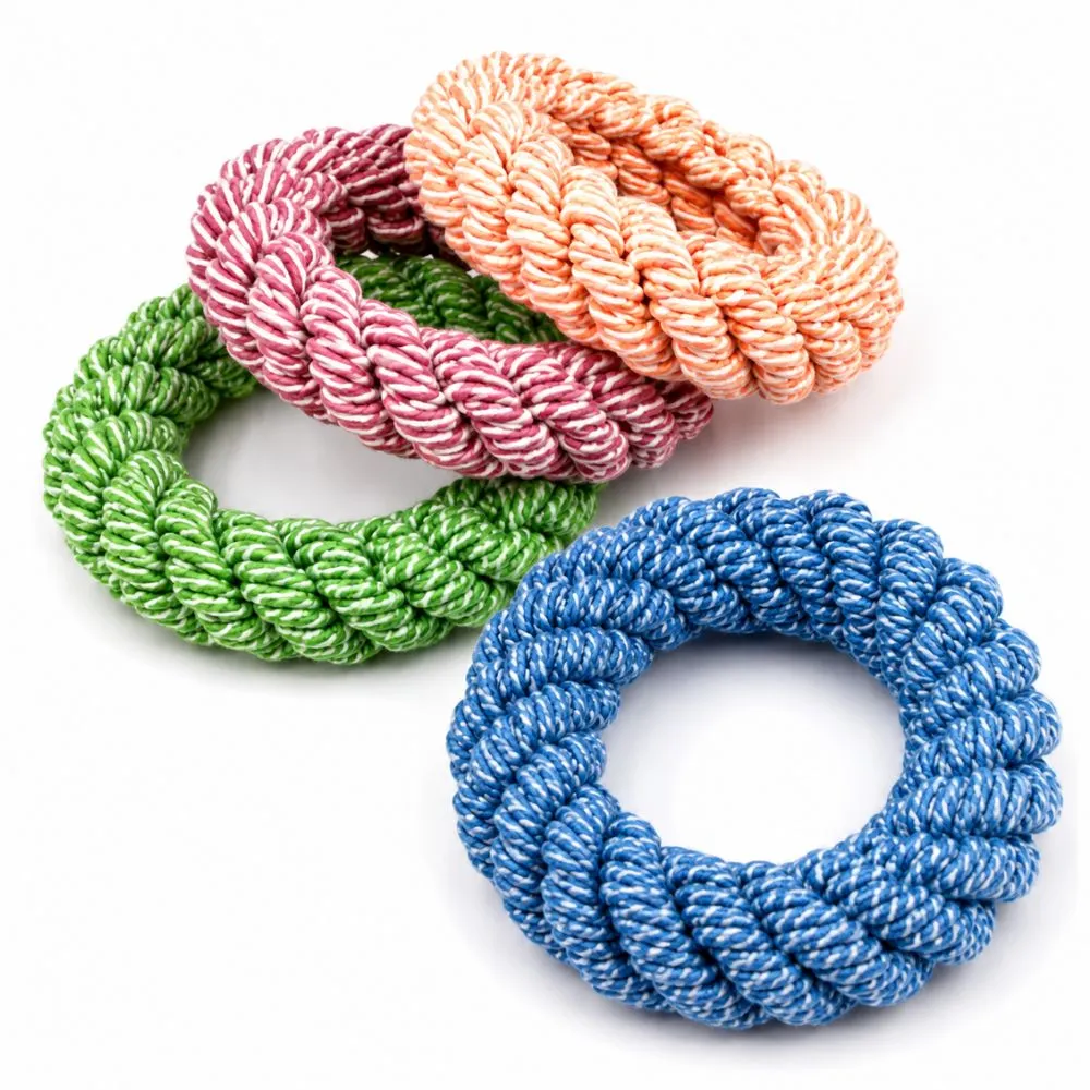 Three cotton rope ring dog toys in pink, green, and blue color variants