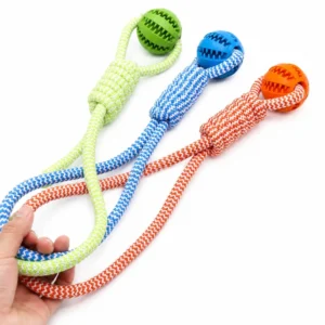 Interactive dog chew toy with rubber ball and rope handle in multiple colors