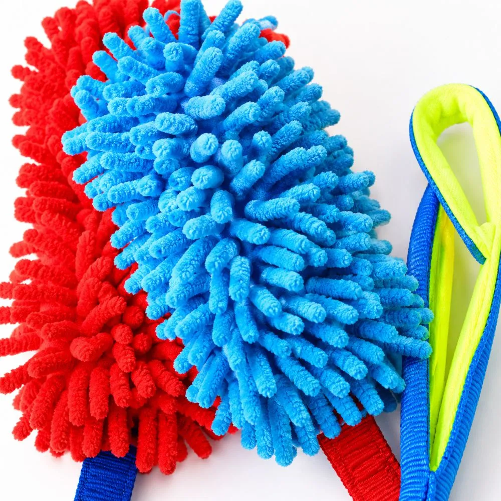 Close-up of a microfiber chenille dog tug toy showing the soft bite pad texture and durable nylon handle for interactive dog training.