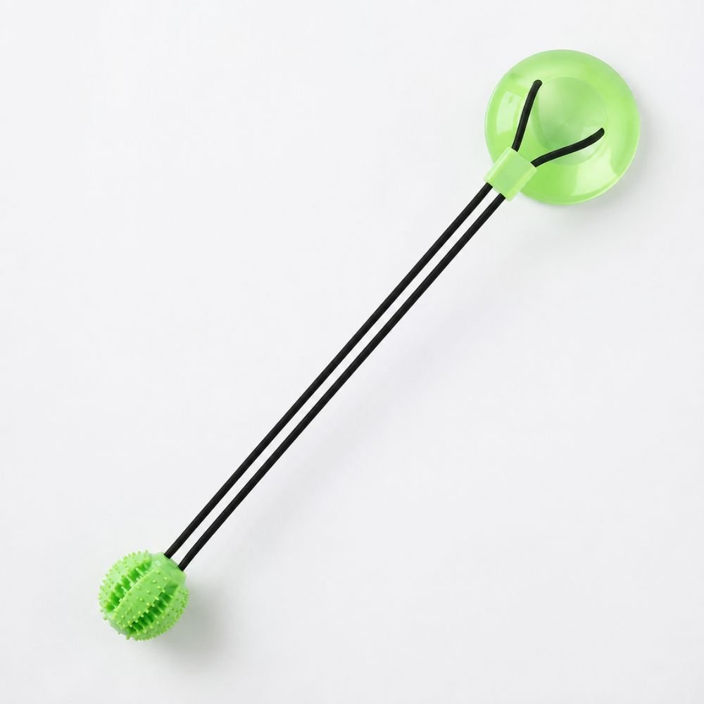 Green TPR dog toy with suction cup base and spiky chew ball