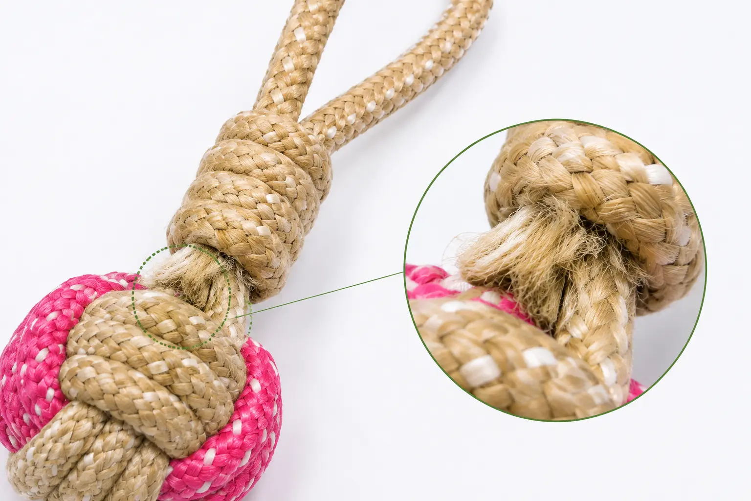Close-up of a frayed rope-to-ball attachment point on a rope ball toy