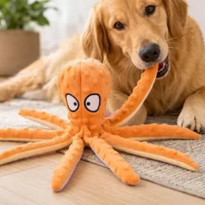 Golden retriever lying down chewing on an orange octopus dog toy