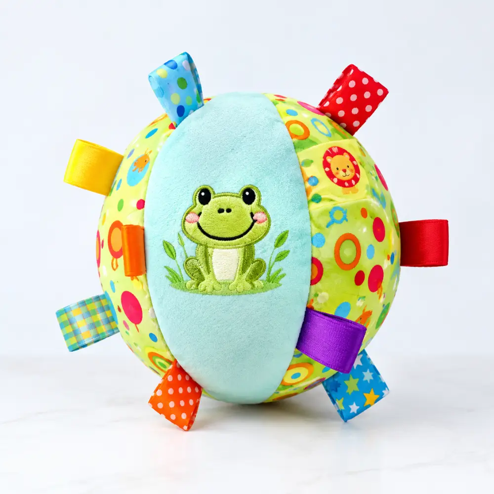 Teal ribbon tag squeaky plush dog ball toy, a puppy teething plush ball with an embroidered frog design